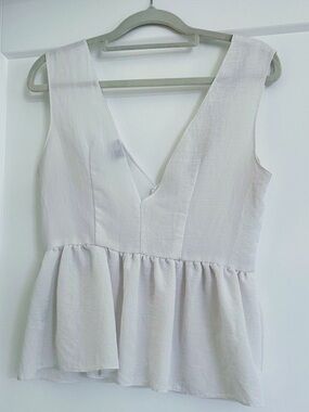 ASOS White peplum top with ruching and a V-neck